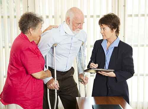 This image shows an attorney meeting with an elderly man who has been injured. A Garden City bus accident lawyer from Cellino Legal will work to get you fair compensation. 