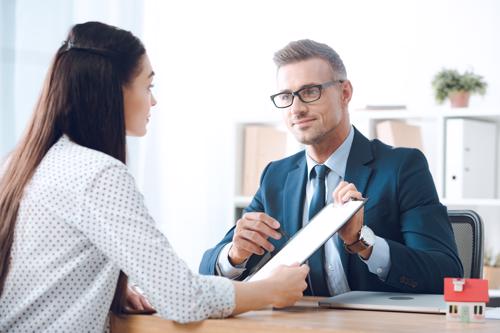 An attorney meeting with a woman for a slip and fall claim.